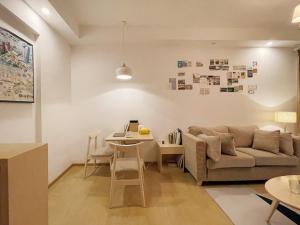 a living room with a couch and a table at Mian's Creative Space in Xiamen