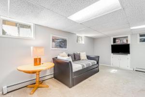 a living room with a couch and a table at Meadow Lodge - Dog Friendly! in Frisco