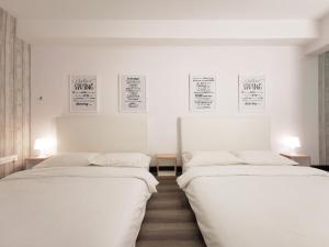 Кровать или кровати в номере Maritime Suites Penang +87 фотографий