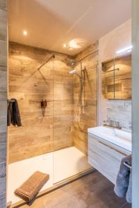 a bathroom with a shower and a sink at vakantiehuis Lavendine Pure in Genk