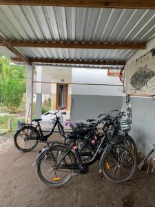 a group of bikes parked in a garage at Rumah DOLE in Gili Islands