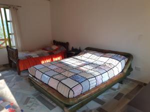 Ліжко або ліжка в номері Hospedaje Rural El Rancho de Amelia y Juancho
