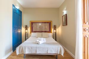 Postel nebo postele na pokoji v ubytování Hotel Albaicín
