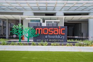 een bord voor een gebouw bij Mid Valley Southkey Mosaic by Greatday in Johor Bahru