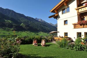 a view of the mountains from the garden of a house at Untersillerhof in Neustift im Stubaital