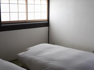 古民家の宿 Soliiにあるベッド