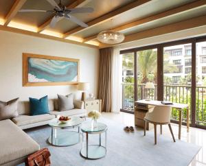 a living room with a couch and a table at Jumeirah Al Naseem Dubai in Dubai