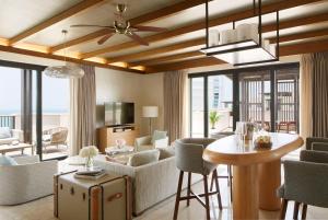 a living room with a couch and a table at Jumeirah Al Naseem Dubai in Dubai