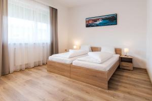 Łóżko lub łóżka w pokoju w obiekcie Appartement Graz - Ihr erstklassiges Zuhause fernab von Zuhause