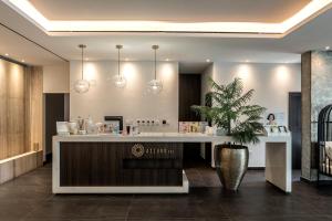 a salon with a counter and a potted plant at Chrysomare Beach Hotel & Resort in Ayia Napa