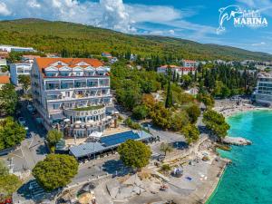 an aerial view of a resort and the water at Hotel Marina in Selce