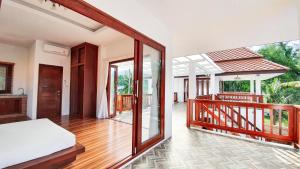Postel nebo postele na pokoji v ubytování Baan Bhuwann Holiday Apartment