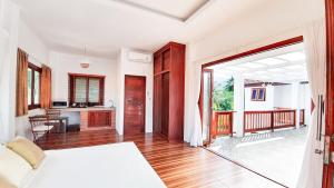 Postel nebo postele na pokoji v ubytování Baan Bhuwann Holiday Apartment