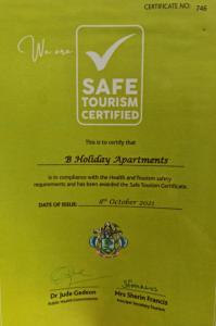 a flyer for a safe tourism center with a picture of a ring at B Holiday Apartments in Beau Vallon
