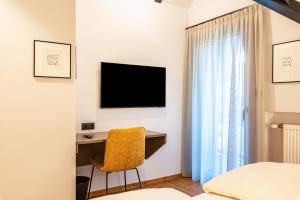 Televízia a/alebo spoločenská miestnosť v ubytovaní Residence Skutial App Santner