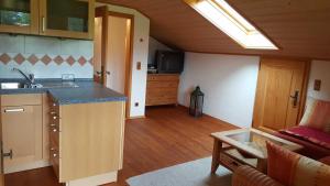 a kitchen with a sink and a counter top at Maria Schnitzenbaumer in Fischbachau