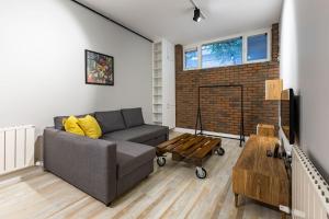 a living room with a couch and a coffee table at Cozy Flat with Central Location in Moda Kadikoy in Istanbul