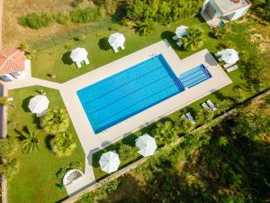 an overhead view of a house with a swimming pool at Apartamentos Costamar in Lloret de Mar