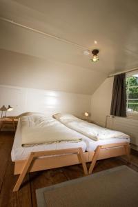 a bedroom with a large bed in a room at Gasthaus Rössli in Trogen