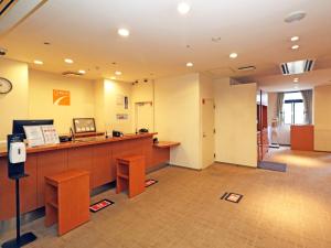 a lobby of a hospital with a reception desk at Chisun Inn Yokohama Tsuzuki in Yokohama