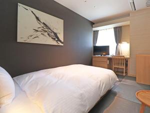 Postel nebo postele na pokoji v ubytování Chisun Inn Yokohama Tsuzuki