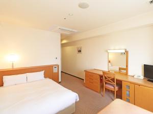 Postel nebo postele na pokoji v ubytování Chisun Inn Yokohama Tsuzuki