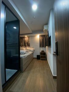 Ένα ή περισσότερα κρεβάτια σε δωμάτιο στο T A B Hotel