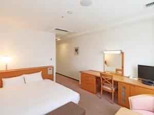 Postel nebo postele na pokoji v ubytování Chisun Inn Yokohama Tsuzuki