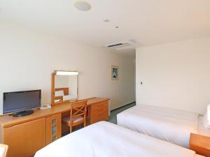 Postel nebo postele na pokoji v ubytování Chisun Inn Yokohama Tsuzuki