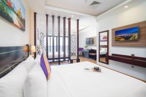 Letto o letti in una camera di Alani Sea View Hotel