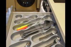 a drawer filled with silver utensils in a kitchen at prime istanbul wonderful apartement in Istanbul