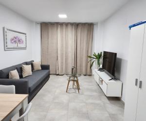 Posezení v ubytování Magnifico apartamento cerca del centro con A.A. - CID 2