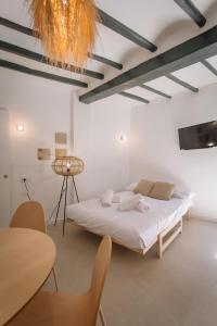 Łóżko lub łóżka w pokoju w obiekcie Mayor 36 by Seaward Suites