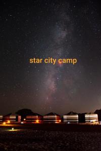 a starry night with a sign that reads star city camp at Star City Camp wadirum in Wadi Rum