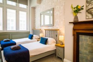 Ένα ή περισσότερα κρεβάτια σε δωμάτιο στο Goodramgate Apartments
