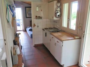 a small kitchen with a sink and a window at Apartment Petite Ramaline - LCA166 by Interhome in Lacanau-Océan