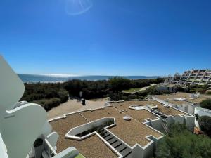a view of the beach from the balcony of a building at Apartment Arena-1 by Interhome in La Grande Motte