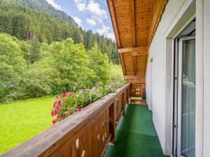 a balcony with a view of the mountains at Apartment Haus Toferer by Interhome in Grossarl