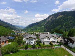 a village in the mountains with houses at Apartment Apt A 086 by Interhome in Disentis +28 photos