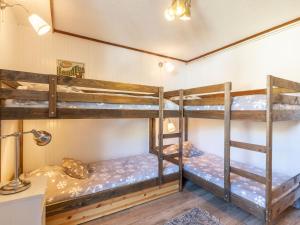 two bunk beds in a room with a lamp at Apartment Le Pramecou - Val Claret-11 by Interhome in Tignes