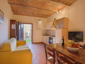 a kitchen and living room with a couch and a table at Apartment Campiglia-3 by Interhome in Tavarnelle in Val di Pesa