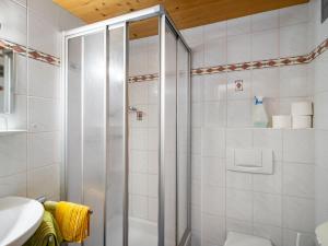 a shower with a glass door in a bathroom at Apartment Kitzsteinhorn by Interhome in Saalfelden am Steinernen Meer