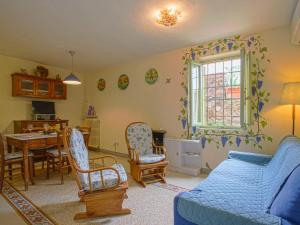 A seating area at Holiday Home Borgo della Limonaia-4 by Interhome