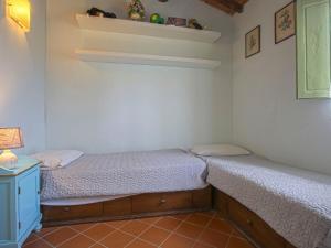 A bed or beds in a room at Holiday Home Borgo della Limonaia-4 by Interhome