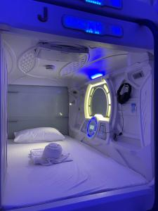 A bed or beds in a room at BMAX SPACEPODS