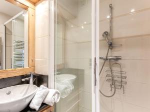 a bathroom with a sink and a shower at Apartment Le Bec Rouge - Le Lac-9 by Interhome in Tignes