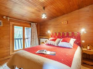 a bedroom with a bed in a wooden room at Holiday Home Le Cafetan by Interhome in Tignes