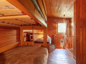 a bedroom with two bunk beds in a cabin at Holiday Home Le Cafetan by Interhome in Tignes