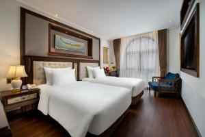 Voodi või voodid majutusasutuse The Q Hotel toas
