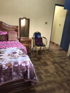 Llit o llits en una habitació de Bel Appartement 2 chambres meublé à Bafoussam